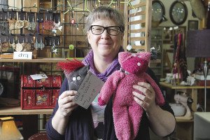 Jill Terrell, shown with two of her creations, has big plans for the Garage