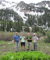 Carl Fisher and Pew Campaign for America's Wilderness staffers Lindsay Woods, Brian Geiger and Dave Bard stand near a patch of skunk cabbage in a proposed wilderness area in Utah's Wasatch Range.