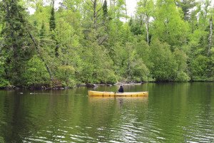 Nasby plays a smallmouth bass on Poplar Lake.