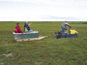 When we left, we rode on the wooden box trailer towed by a snowmobile to get back to Winisk River, about half-mile from campsite.