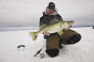 Davis Viehbeck of Thunder Bay and a fat winter walleye taken through the ice. | Gord Ellis
