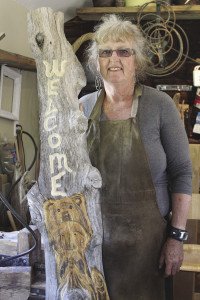 Plater with a carving she showed at the Art Escapes show.