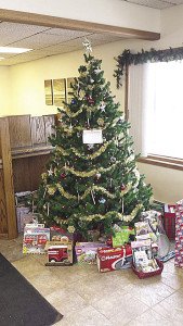 Donate cash or a non-perishable food item to the Giving Tree at any NSFU branch.| Submitted