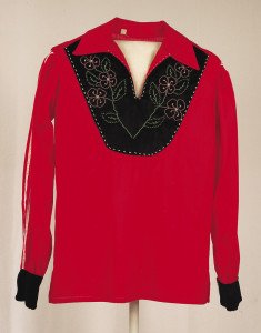“Ribbon Shirt,” created by Vanessa Myra David, is made from cotton, glass beads, plastic buttons and ribbons. It is part of the “Garments of Everyday Life” collection. | THUNDER BAY ART GALLERY