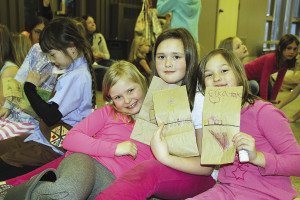 Local Girl Scouts celebrate the organization’s 104th anniversary. In a few weeks, the Girl Scouts troops will fill and assemble the purses with donated goods, write personal notes, and hear Marybeth Wilkes teach about domestic violence. |SUBMITTED