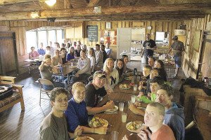  Students from a variety of trips and programs gather for a celebration supper in the lodge. | LINDEN FIGGIE