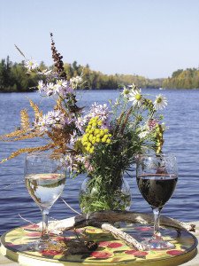 Enjoy a view of the lake while sipping a glass of wine. | THE DANCING BEAR CAFÉ