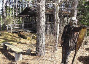 A statue of Dorothy in front of her Winter Cabin welcomes visitors to her museum. | Scott Stowell
