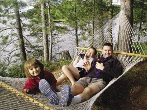 Grace, Sam, and Eric relaxing. | SHELLEY CHANDLER