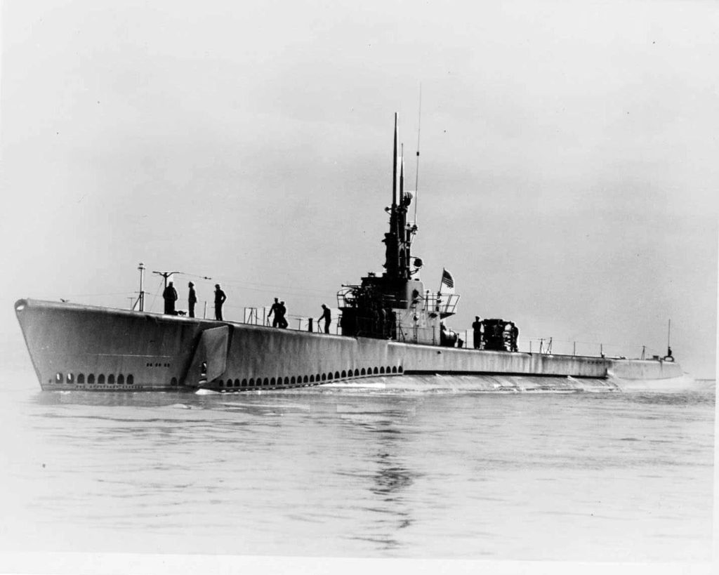 Port side view of the USS Mero, a Balao-class submarine, underway on sea trials in Lake Michigan circa September 1945. The last sub to be built by Wisconsin's Manitowoc Shipbuilding Company, it cruised the Great Lakes for three months visiting ports before transported by floating drydock via Mississippi River to New Orleans and then on to Pearl Harbor. Sold to Turkey in 1973, discarded by Turkish Navy in 1977 and used for spare parts. 
