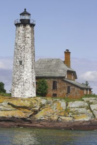 Menagerie Island Lighthouse (also known as Isle Royale Lighthouse) shown here in 2004, was first lit in September 1875. John H. Malone was the keeper here for 32 years, from 1878 to 1910. | Wikimedia Commons