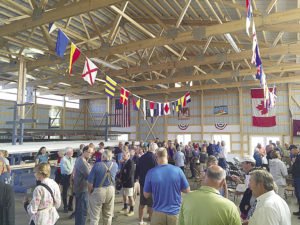 The crowd celebrates after the dedication of the new Joseph M. Krmpotich Boathouse. | ERIC CHANDLER