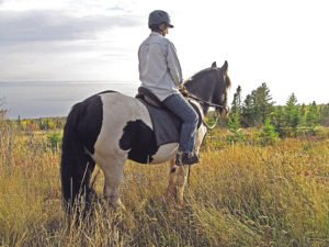 Val Littfin rides on various Cook County trails with the Sawtooth Mountain Saddle Club. | VICKI GERETSCHLAEGER