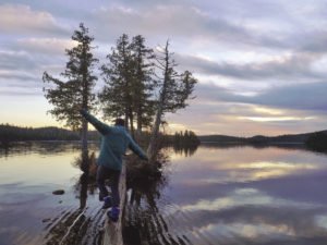 Dave goofs around on a wilderness balance beam at sunrise.