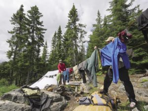 The Freemans hang their clothes to dry on Snipe Lake after a rainy week in June.