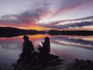 After recording a pack of wolves howling for several minutes for their weekly WTIP podcast, Dave and Amy tilt their heads back and howl, hoping the wolves will howl back.