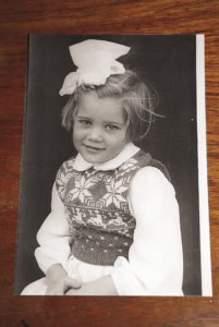 A photo of four-year-old Elle in Lowestoft,  England, dressed in a white, Christmas snowflake sweater knitted by her mom.  | ELLE ANDRA-WARNER