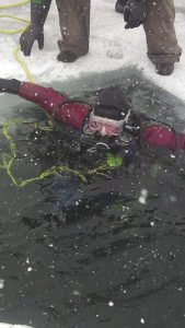 A diver braves the cold and ice.