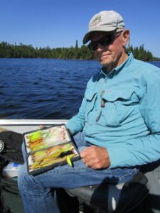 Dan Johnson of Oakdale shows a few of the flies he brought to the Nipigon country. | SHAWN PERICH