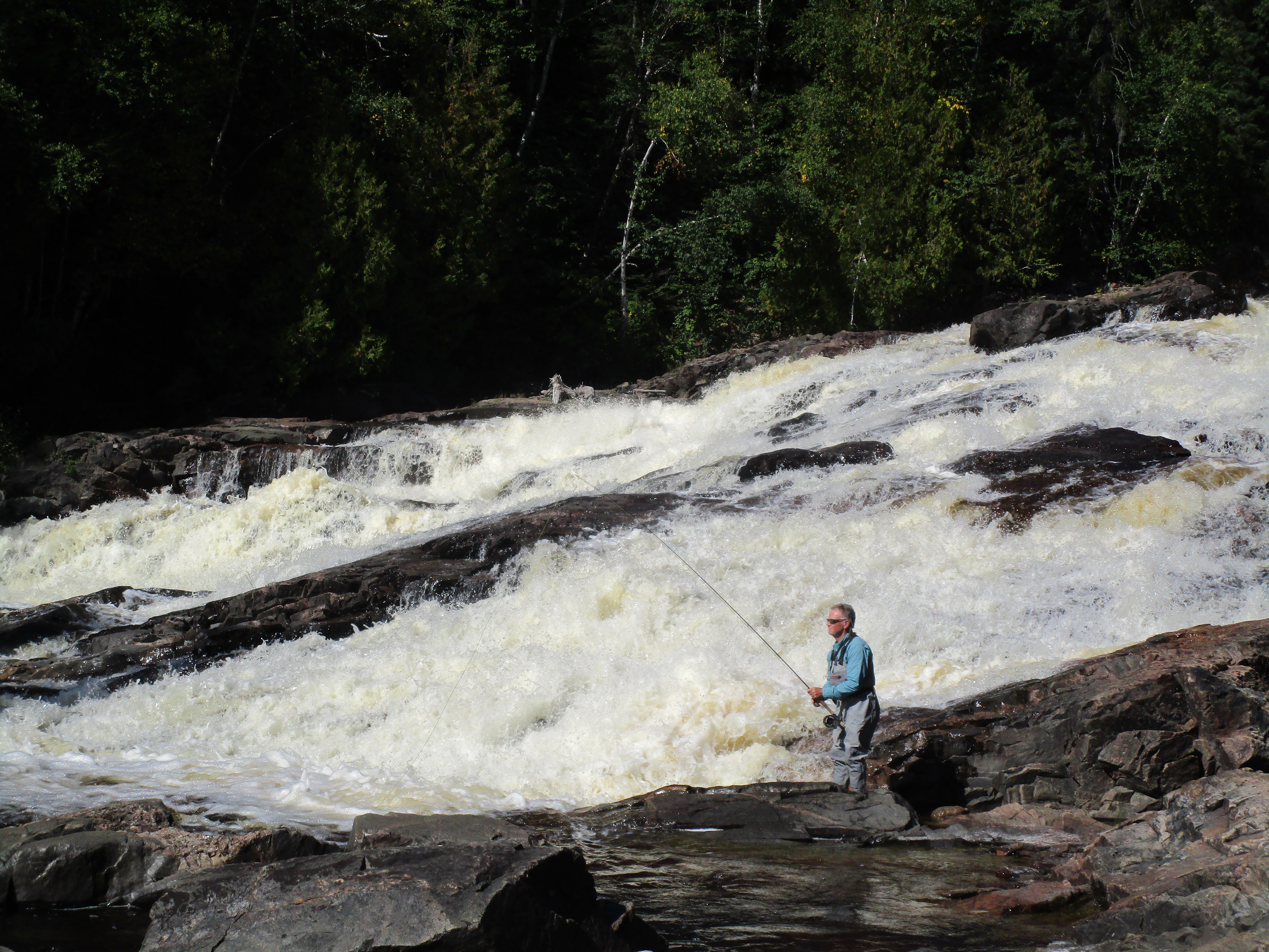 Dan Johnson makes a cast in a scenic Lake Superior tributary, while fishing for brook trout. | SHAWN PERICH