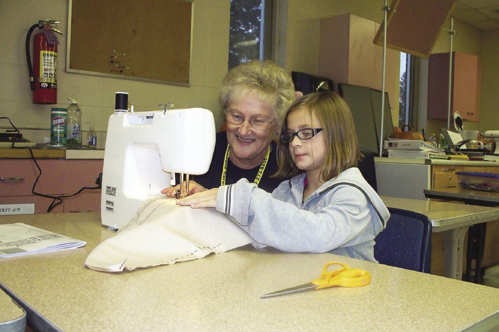 Many AGE to age sites undertake projects with older adults teaching kids various skills, such as sewing.