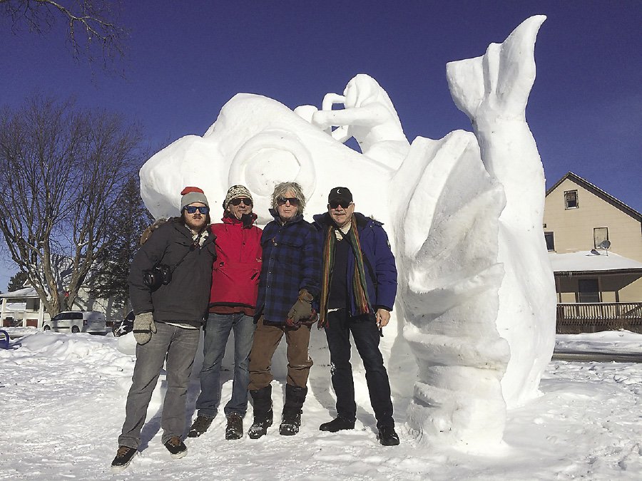 Snow sculpting teams submit a design and work together to sculpt their blocks of snow.