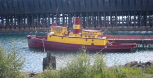 The retired Edna G, seen here moored at Two Harbors, was the last steam-powered coal-burning tugboat on the Great Lakes. ELKMAN