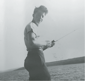 A young Ray Dupuis Sr. fishing.
