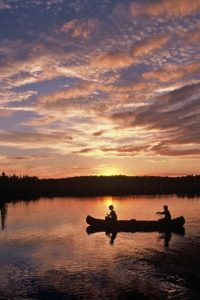 The sunset on Alpine Lake in July 1998 was picture perfect. That picture changed drastically following the Boundary Waters Blowdown of 1999. | LARRY STONE